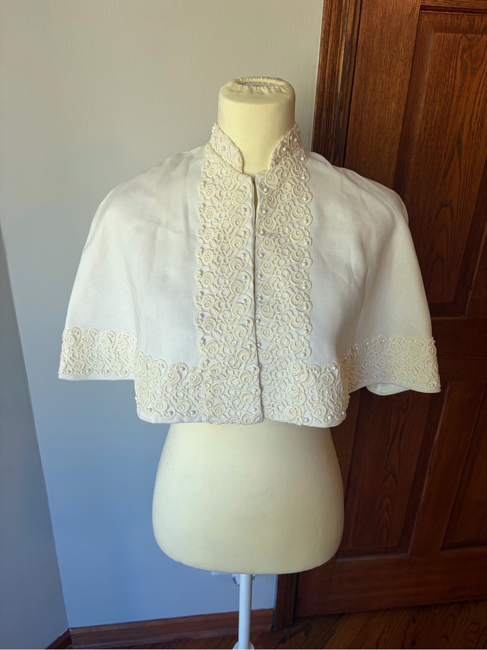 White lace bolero capelet with floral embroidery and beaded details